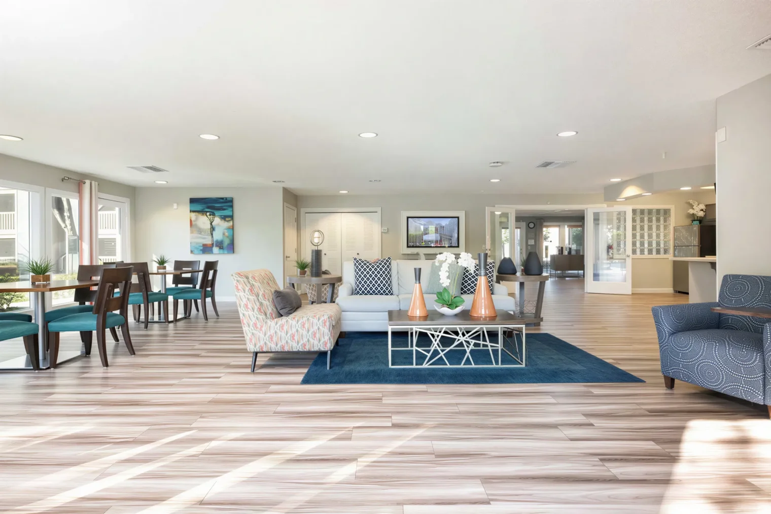 Spacious resident clubhouse with lounge and dining areas at Arbour Ponds Apartments in Tampa, FL