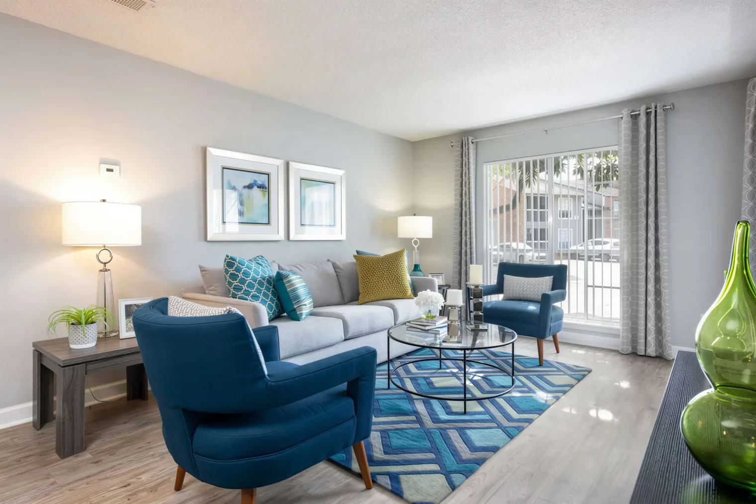 Bright apartment living room with large windows and modern furnishings at Arbour Ponds Apartments